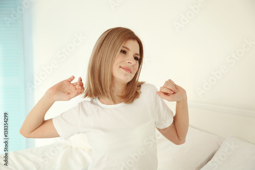 Young attractive woman waki...