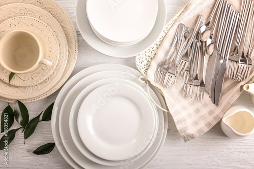 White dishes on wooden table