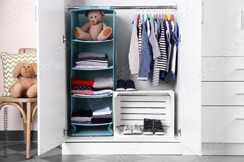 фотографія Wardrobe with kid clothes