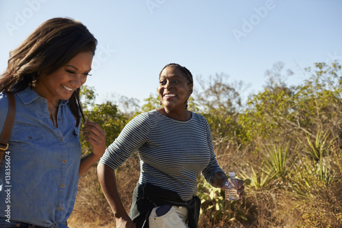 Mother And Adult Daughter Hiking Outdoors In Countryside © Monkey Business