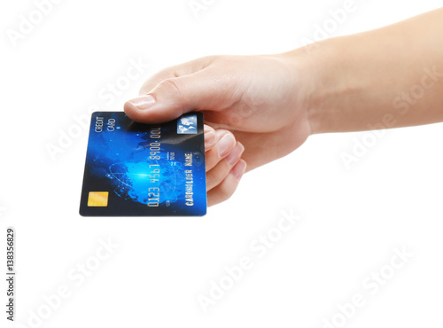 Hand holding credit card is...