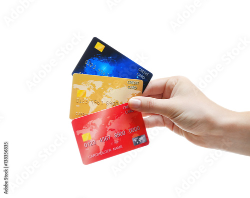 Hand holding credit cards i...