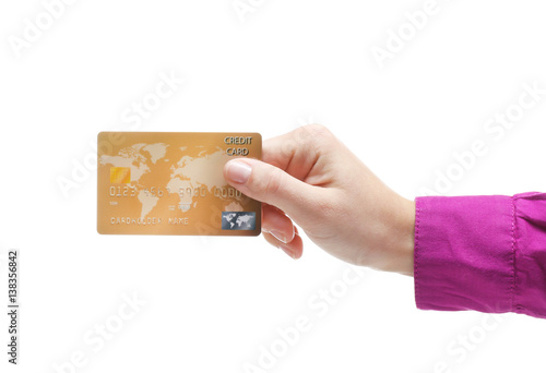 Hand holding credit card is...