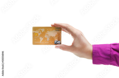 Hand holding credit card is...