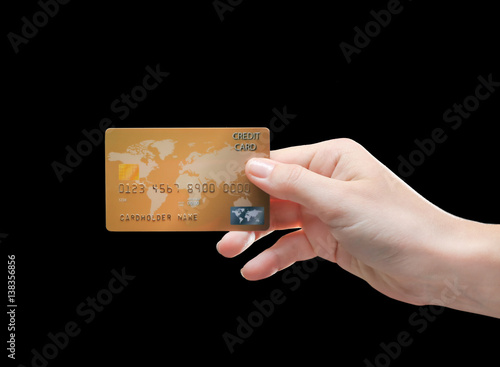 Hand holding credit card on...