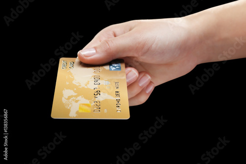 Hand holding credit card on...