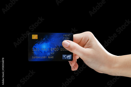 Hand holding credit card on...