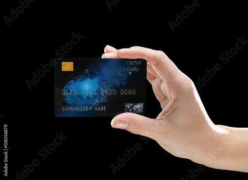 Hand holding credit card on...