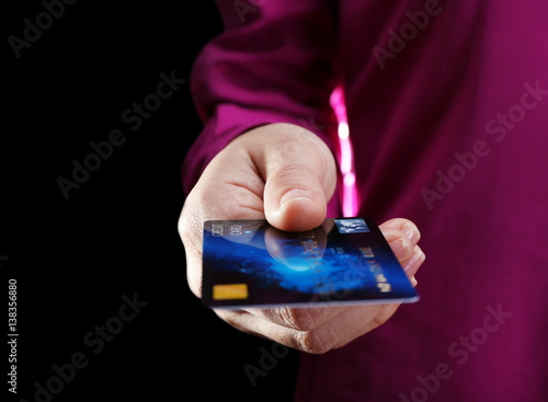 Woman holding credit card, ...