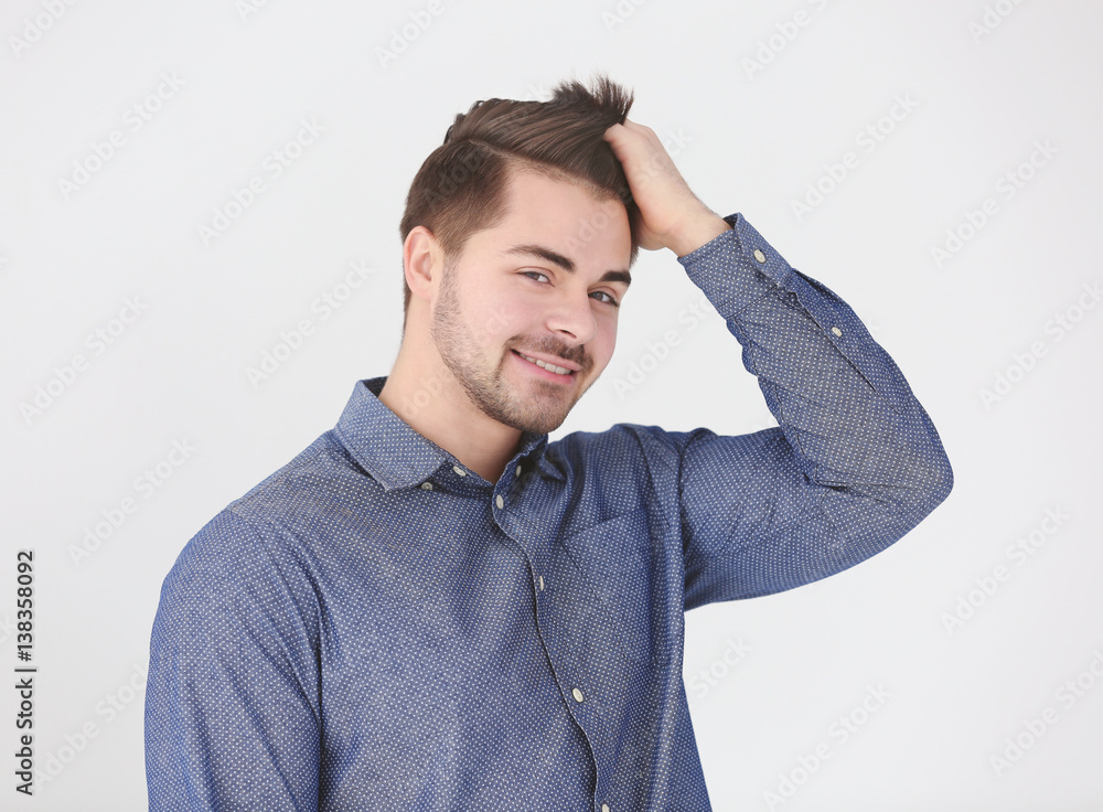 Handsome young man on light background Handsome young man on light background