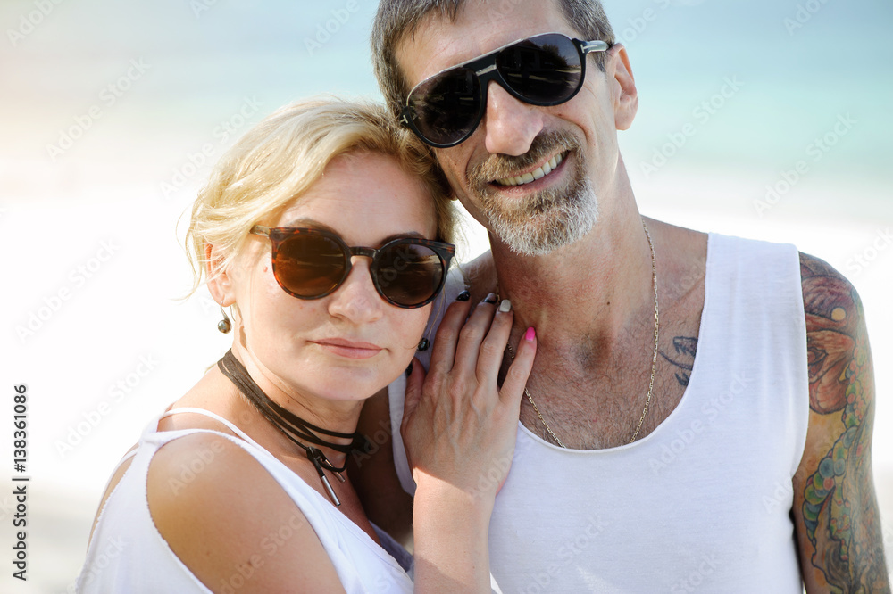 Happily married middle-aged couple posing together Happily married middle-aged couple posing together