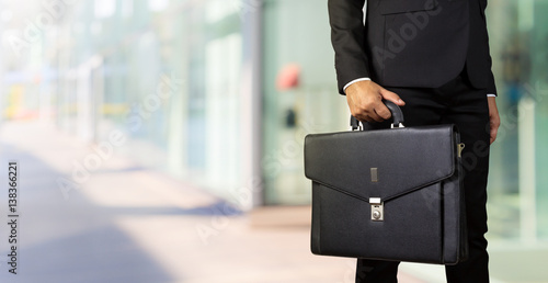 Businessman holding a briefcase photo
