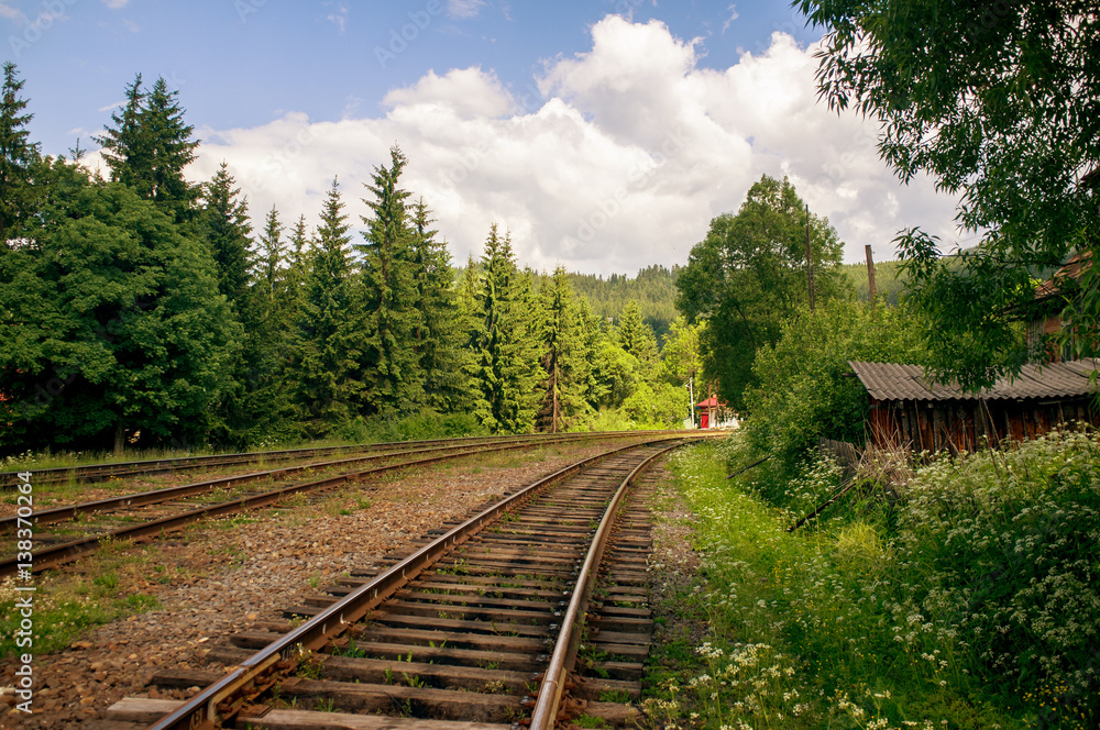 Fototapeta premium Railroad in mountains countryside,blue sky