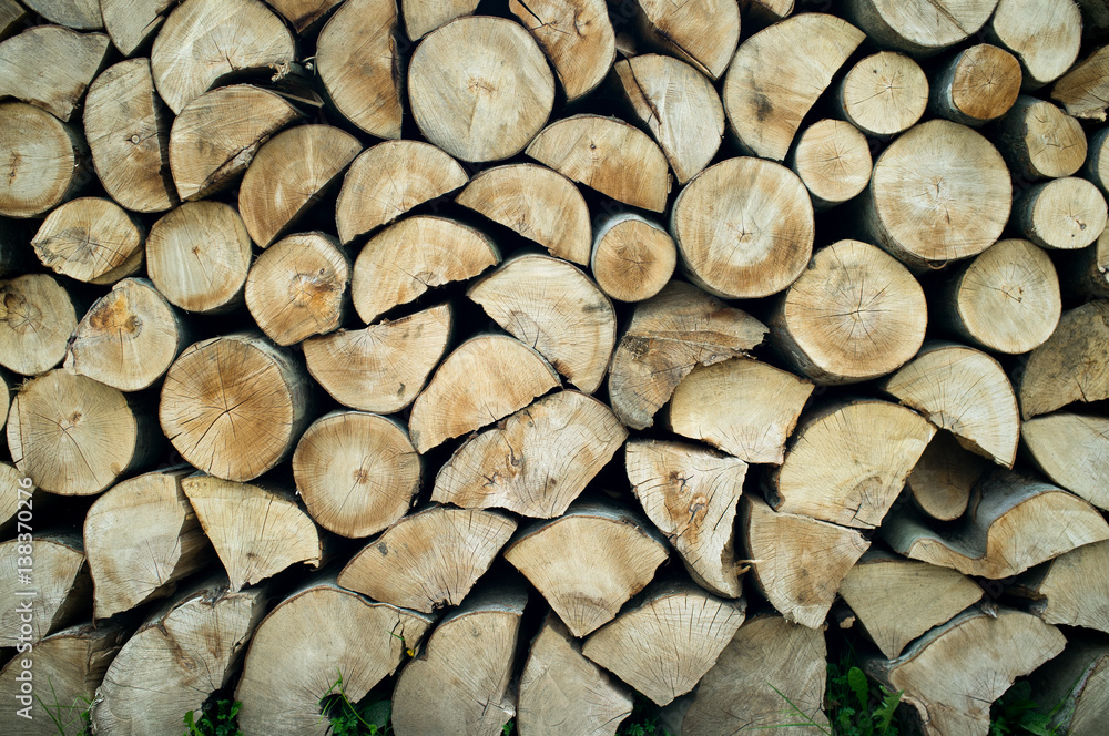 Natural wooden background, closeup of chopped firewood. Natural wooden background, closeup of chopped firewood.