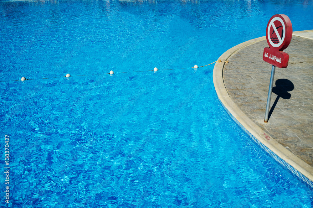 Blue water in the swimming pool, safety buoys