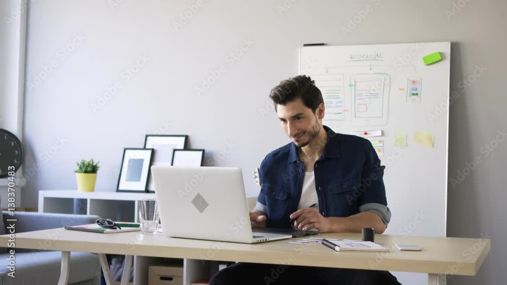 Graphic designer working at home office doing freelance job. Graphic designer working at home office doing freelance job.