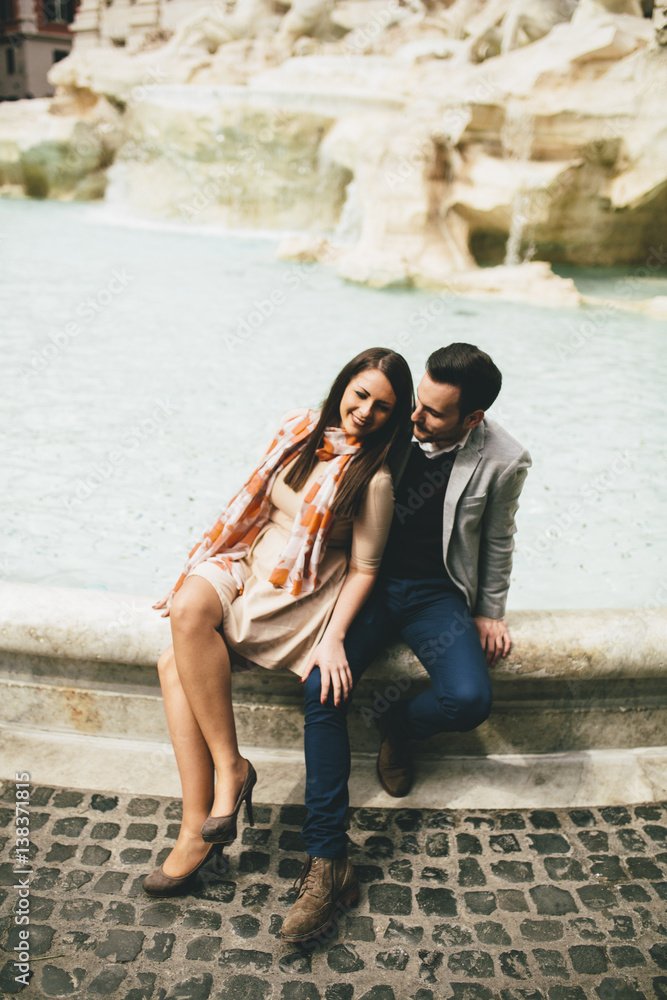 tourist couple on travel by Trevi Fountain in Rome, Italy. tourist couple on travel by Trevi Fountain in Rome, Italy.