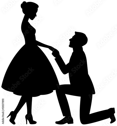 Man on his knees makes a proposal to marry the girl