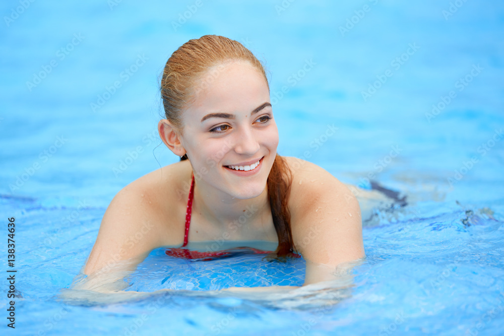 Young girl relaxing in thermal pool