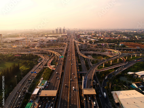 Aerial view Road roundabout. Expressway with car lots in the city in Thailand. Street large beautiful downtown. cityscape. Top view.