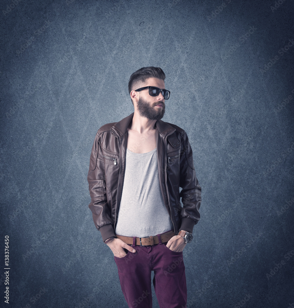 Bearded hipster standing in elegant clothes Bearded hipster standing in elegant clothes