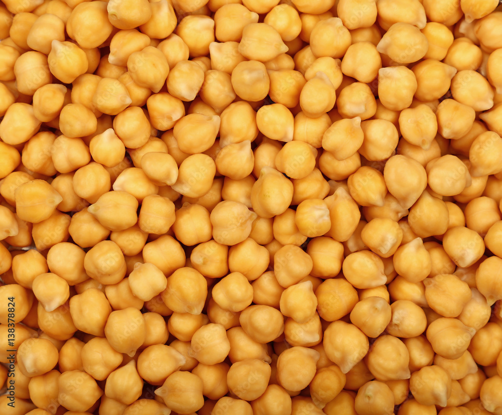 Cooked soaked chickpea beans close up background Cooked soaked chickpea beans close up background