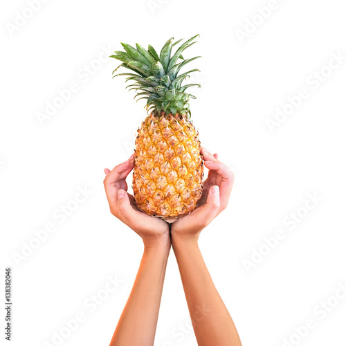 A pineapple.Pipe Pineapple in hand studio white background. Fruit Pineapple. Arms. Asia.