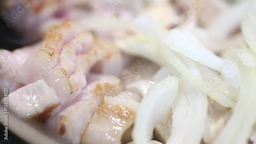 meat with mushrooms and onions fried in a pan