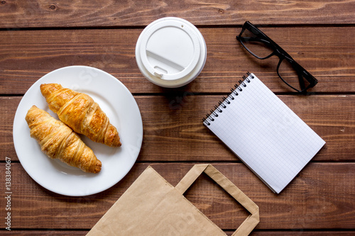 Business breakfast with coffee and croussant top view photo