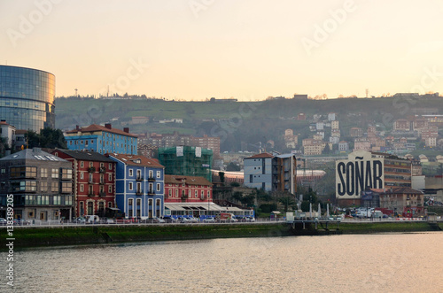 Atardecer en Bilbao con el edificio de soñar al fondo  photo