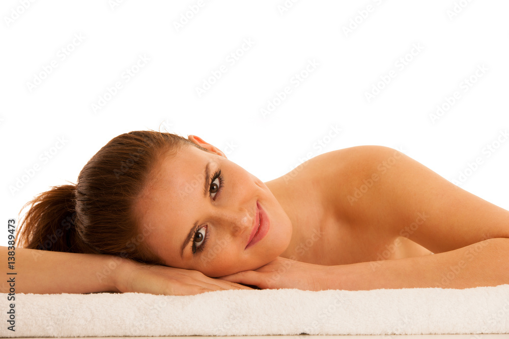 woman rests on white towel - conceptual photo for skin care and spa woman rests on white towel - conceptual photo for skin care and spa