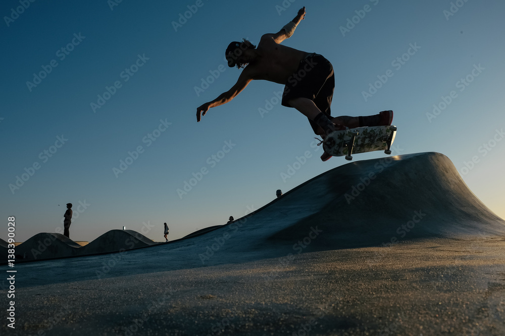 Skateboarder in mid air doing skateboard trick