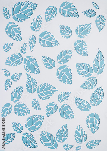 white, blue background leaves. leaves cut from paper