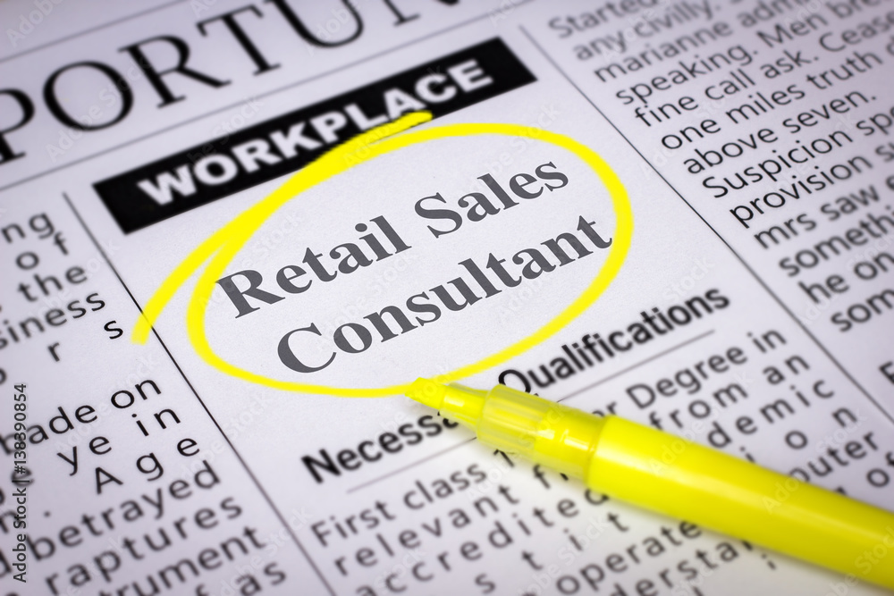 Retail Sales Consultant - Newspaper sheet with ads and job search, circled with yellow marker, Blurred image and selective focus