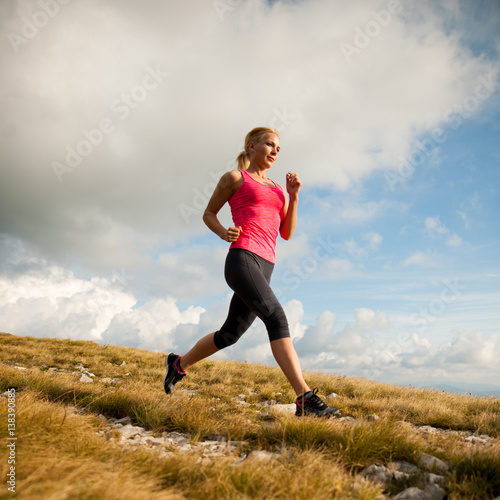 runner - woman runs cros country on a path in early autumn © Samo Trebizan