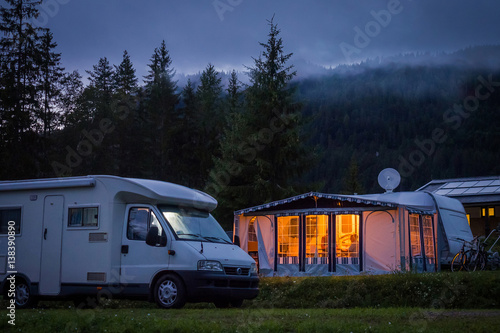 Campervan and awning in austrian camping at night photo