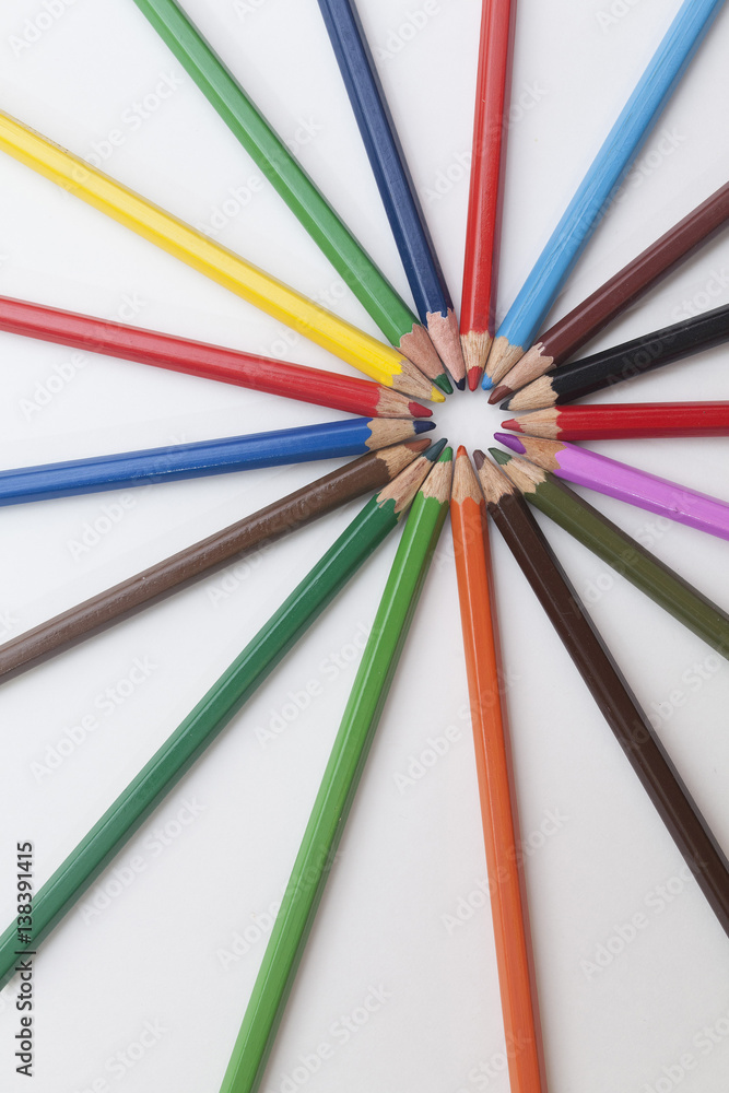 colored pencils laid out in the shape of the sun