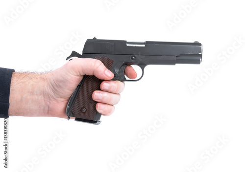 Hand holding pistol handgun isolated on white background