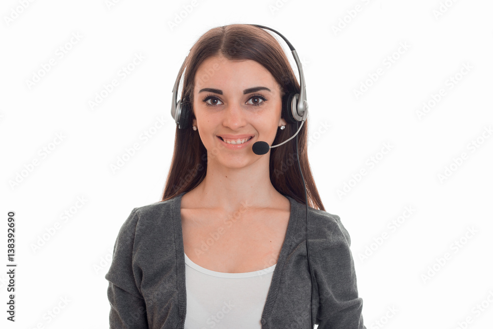 young happy business woman in uniform with headphones and microphone looking at the camera and smiling isolated on white background young happy business woman in uniform with headphones and microphone looking at the camera and smiling isolated on white background
