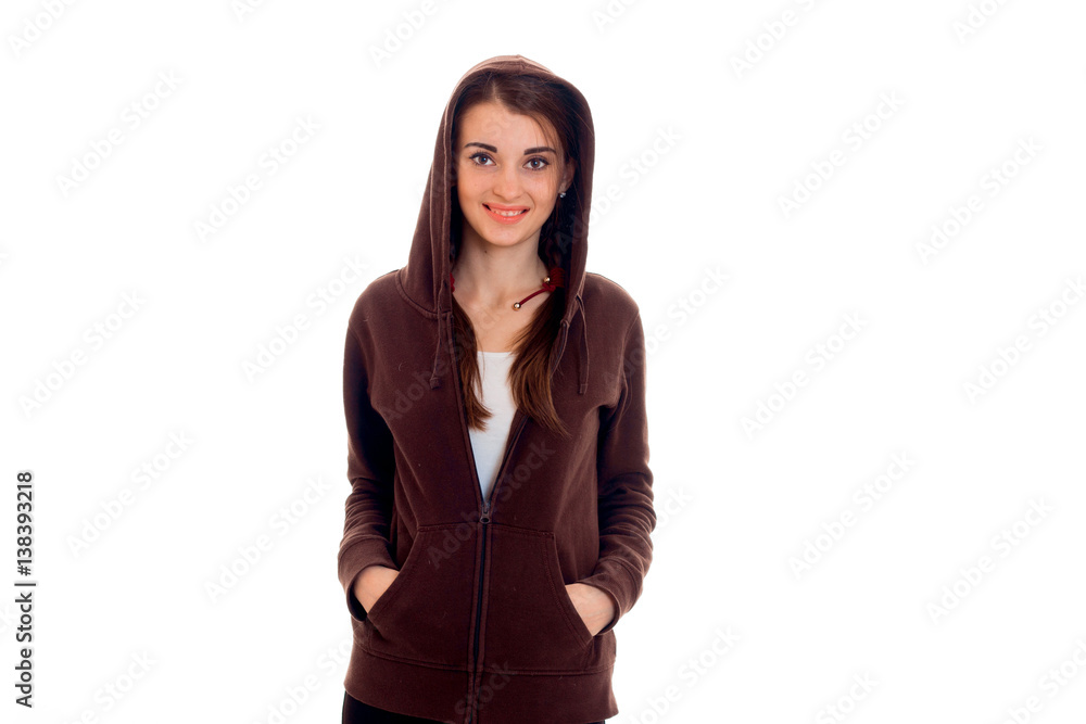 stylish happy brunette student girl in brown sports clothes looking at the camera and smiling isolated on white background stylish happy brunette student girl in brown sports clothes looking at the camera and smiling isolated on white background
