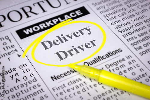 Delivery Driver - Newspaper sheet with ads and job search, circled with yellow marker, Blurred image and selective focus