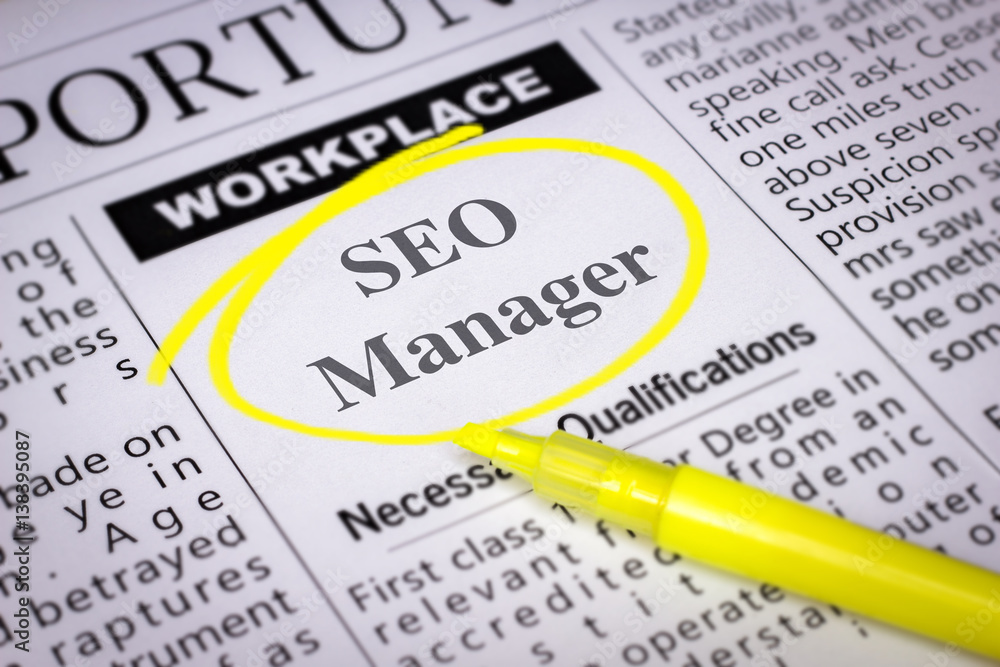Obraz premium SEO Manager - Newspaper sheet with ads and job search, circled with yellow marker, Blurred image and selective focus