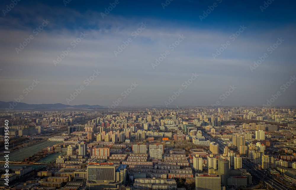 BEIJING, CHINA - 29 JANUARY, 2017: Incredible views over capitol city from top of old CCTV tower, buildings visible as far as you can see, nice blue sky