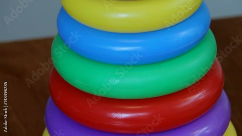 Wallpaper Mural Children's Toy Pyramid on Brown Wooden Table Torontodigital.ca