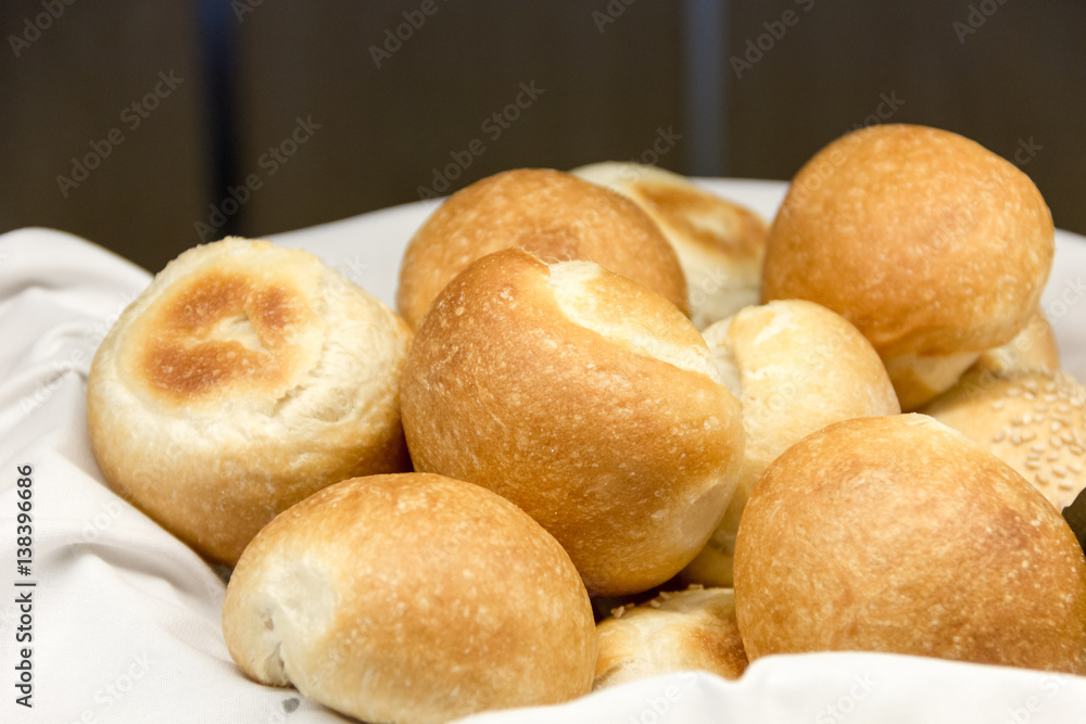 Buns in basket with white cloth