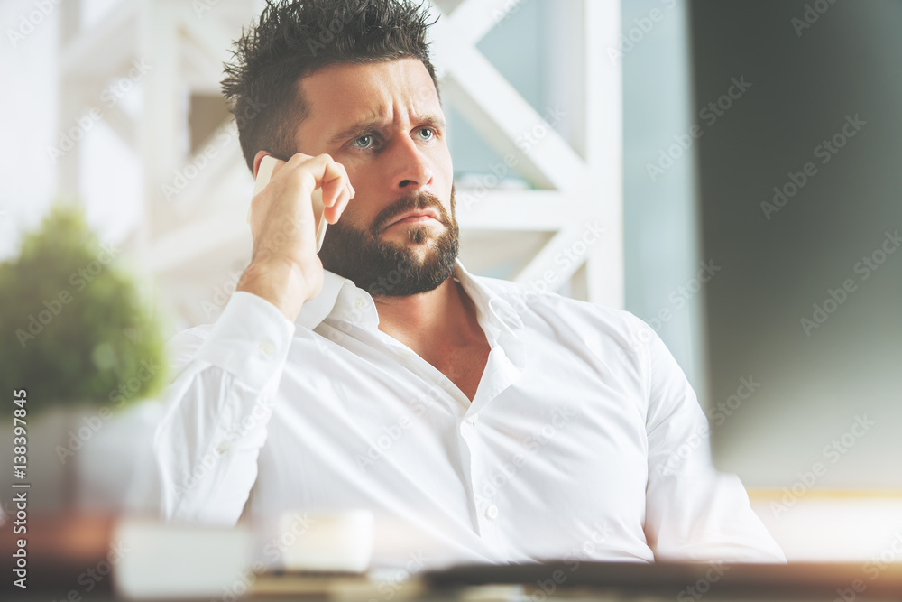Confused man at workplace Confused man at workplace