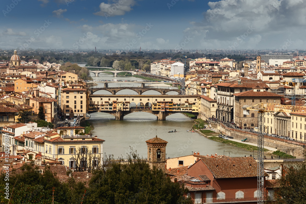 across the river Arno is spanned by several beautiful bridges, the most popular with tourists, the Ponte Vecchio and the Ponte Santa Trinita and Ponte alle Grazie