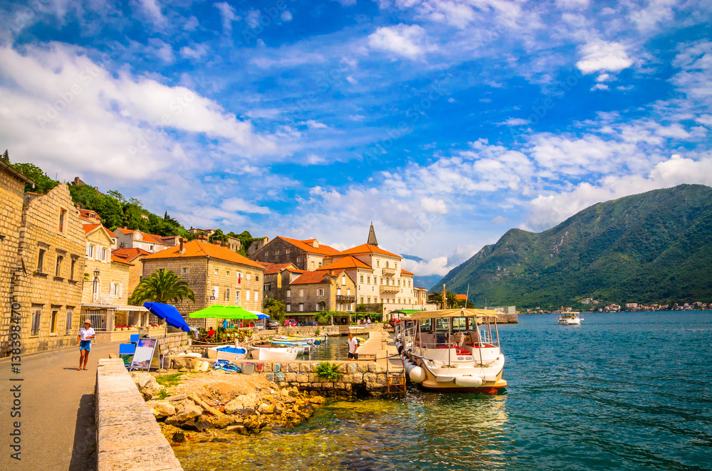 beautiful mediterranean landscape. Mountains and fishing boats near town Perast, Kotor bay (Boka Kotorska), Montenegro.