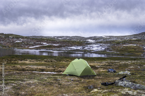 Travel background. Camping tent in Norway mountains