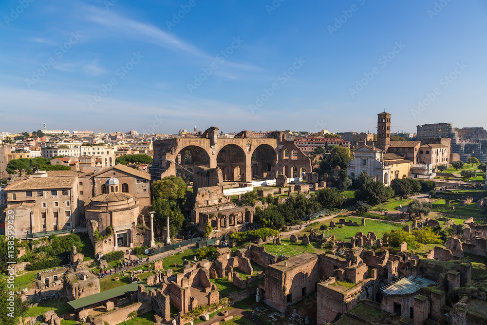 Rome, Italy. The ruins of the Roman Forum: Temple of Romulus, Santi Cosma e Damiano, Basilica of Maxentius, the Church of Santa Francesca Romana